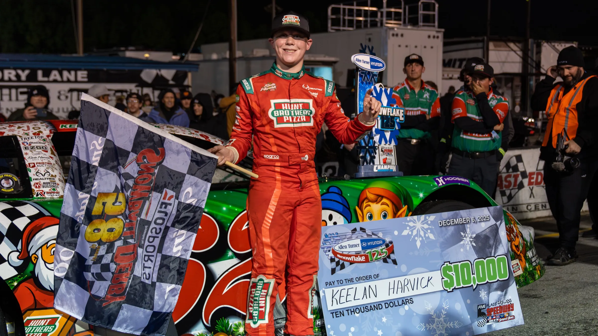 Keelan Harvick celebrating a Late Model victory in his Hunt Brothers Pizza firesuit